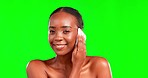 Black woman, wipe to remove makeup and beauty with face, smile and cosmetic care on green screen. Facial, skincare and hygiene with dermatology and female in portrait on studio background with mockup