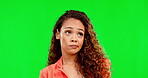 Face, attitude and expression with a woman on a green screen background in studio shrugging her shoulders. Reaction, behavior and feelings with an attractive young female on chromakey mockup