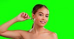 Skincare, jade roller and face of woman in studio for beauty, wellness and anti aging on green screen background. Facial, portrait and girl real with massaging tool, facelift and lymphatic drainage 