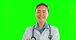 Happy, face and a doctor with arms crossed on a green screen isolated on a studio background. Smile, portrait and Asian female surgeon with confidence, pride and laughing with backdrop mockup space