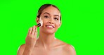 Makeup, beauty and brush on face of woman in studio for wellness, cosmetic or glamour on green screen background. Skincare, portrait and girl model relax with makeover, tool or contour while isolated