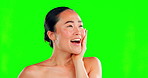 Beauty, green screen and touch or click with an asian woman in studio looking surprised by a skincare option. Portrait, face and skin with an attractive young female on chromakey mockup for cosmetics