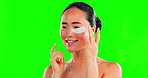 Face, skincare and Asian woman with eye patches on green screen in studio isolated on a background mockup. Dermatology, cosmetics and happy female model apply facial mask for healthy skin treatment.