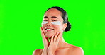 Asian woman, skincare and face with eye patches on green screen in studio isolated on a background. Dermatology, beauty cosmetics and happy female model with facial collagen pads for healthy skin.