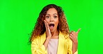 Shock, green screen and woman in a studio pointing at mockup space for advertising or marketing. Surprise, amazed and portrait of model showing mock up for product placement by chroma key background.