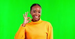 Black woman, okay sign and smile portrait on green screen with hand emoji and happiness for thank you. Face of happy female person with like icon for feedback, review and ok or mockup vote in studio