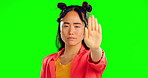 Stop, hand and serious with asian woman in studio for warning, protest and reject. Forbidden, refuse and control with portrait of female on green screen background for decline, prohibited or security