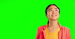 Green screen, mockup and Asian woman looking in a studio for marketing, advertising or product placement. Happy, smile and female model with a wondering face expression by a chroma key background.