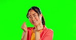 Happy, showing and face of Asian woman on a green screen isolated studio background. Smile, giving and portrait of a Japanese girl with a hand gesture for happiness, looking and laughing with mockup