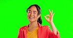 Happy woman, ok hands and face in studio, green screen and background of supporting agreement. Asian model, portrait and okay gesture of success, yes and smile of winner, perfect emoji and thank you