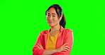Annoyed, disappointed and arms crossed with Asian woman in studio for angry, conflict and suspicious. Mad, negative and attitude with female on green screen background for upset, frustrated or ignore