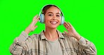 Dance, smile and face of a woman with music on a green screen isolated on a studio background. Energy, free and portrait of a dancing girl enjoying, listening and streaming radio, songs or audio