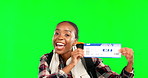Excited, green screen and face of black woman with ticket for travel isolated on a studio background. Happy, smile and portrait of African girl showing a traveling pass for a holiday with peace sign