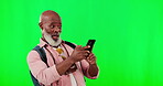 Black man, surprise and phone on green screen for wow face for notification or network connection. African senior male on a studio background with mockup space and smartphone as competition winner