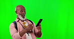 Black man, phone and surprise on green screen for wow face for notification or network connection. African senior male on a studio background with mockup space and smartphone as competition winner