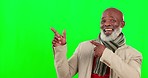 Face, green screen and black man pointing, mockup and happiness against studio background. Portrait, African American male or mature guy with gesture for space, product placement or brand development