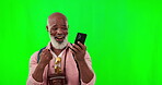 Black man, winner and phone to celebrate on green screen with fist or hand for bonus, lottery or prize. Excited african male with smartphone for happy notification for sale, promotion or online bet