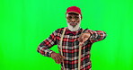 Dance, music and a funky senior black man on a green screen background in studio having fun moving to rhythm. Party, fashion and funky with a happy elderly man dancing on chromakey mockup for freedom