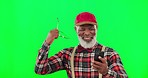 Phone, celebrate and man in a studio with green screen winning an online bet with mockup. Happy, excited and African senior male winner celebrating with a cellphone isolated by chroma key background.