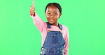 Little girl, face and thumbs up on green screen for good job, approval or success against studio background. Portrait of African American child or kid showing thumb emoji, yes sign or like on mockup