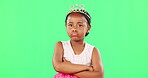 Children, miserable and arms crossed with a black girl on a green screen background in studio. Portrait, tantrum and unhappy with a moody little female child sulking alone on chromakey mockup