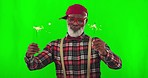 Senior man, sparkler and green screen for holiday celebration, dancing and hipster fashion in studio. Elderly male, dance and fireworks in portrait for happiness, celebrate for birthday by background