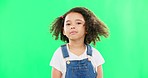 Hair, happy and face of child on green screen in studio shaking head, natural curls and curly hairstyle. Beauty, childhood and portrait of young girl with happiness, self love and shake for haircare