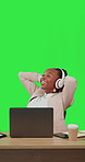 Black woman, laptop and headphones at desk on green screen for business and learning with smile. African female entrepreneur with internet for education or music while laughing and finish on internet
