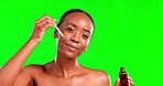 Face, skincare and black woman with beauty oil, serum or liquid product in studio on green screen background. Portrait, serum and girl skin model relax with pamper, hyaluronic acid or retinol routine