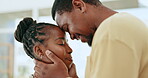 Love, kiss and happy with black couple in living room for bonding, support and affectionate. Trust, relationship and care with man and woman together at home for relax, embracing and marriage 