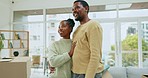 Black couple, hug and smile together in new home with conversation, care and love with bonding. Man, woman and celebration with support, pride or romance with solidarity in house for partnership goal