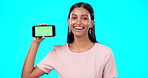 Advertising, green screen and woman with phone for product placement, branding and mobile app advertising. Smile, happy and portrait of professional female isolated in a studio blue background