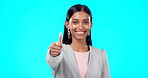Thumbs up, perfect and happy businesswoman doing accept hand gesture, sign or symbol with smile. Excited, agreement and portrait of female showing approval isolated in blue studio background