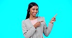 Call center, portrait or happy woman in studio pointing for promotion or product placement on blue background. Smile, mockup space or Indian girl in headset at technical support or customer services