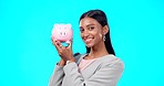Portrait, piggy bank or happy Indian woman with savings budget or financial profits growth on studio background. Smile, finance or excited girl holding financial tin for cash loan or money investment