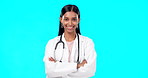 Studio woman, confidence and happy doctor, female surgeon or nurse for support, medical healthcare or health. Medicine professional pride, cardiology portrait and hospital person on blue background