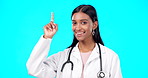 Healthcare doctor, smile and woman point at medical promotion, hospital notification or clinic announcement mockup. Nurse portrait, studio advertising surgeon and marketing female on blue background
