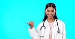 Medical doctor, nurse and happy woman point at mock up promotion, hospital notification or announcement mockup. Healthcare portrait, studio advertising surgeon and marketing female on blue background