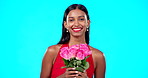 Face, flowers and bouquet of happy woman in studio, blue background and backdrop. Portrait female model, roses and smile for floral present, gift and celebration of valentines day, beauty and blossom