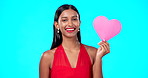 Happy, woman or heart paper sign for Valentines Day, studio care and emoji love icon, symbol or poster. Portrait girl, female beauty or Indian person with romantic support isolated on blue background