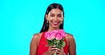 Happy, flower bouquet and beauty woman wink with nature gift, sustainable agriculture portrait and natural present. Eco friendly product, floral studio roses and person smell aroma on blue background