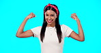 Flexing, empowerment and woman showing arm muscle, strong and happy person isolated in a studio blue background. Bicep, strength and portrait of an excited female for body positivity