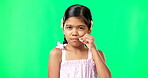 Children, secret and trust with a girl on a green screen background in studio zipping her lips. Portrait, kids and silent with an adorable little female child making a promise to keep quiet