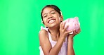 Greenscreen, face and girl child with piggy bank in studio, happy and excited for savings on mockup background. Portrait, money and box by Mexican kid smiling for cash, growth or future planning