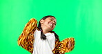 Happy, dance and energy with girl in green screen studio for celebration, crazy and freedom. Comic, excited and music with child dancing and isolated on background for party, movement and youth