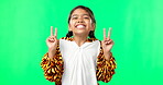 Happy, dance and peace sign with girl in studio for kindness, positive and pride. Happiness, support and gesture with young child isolated on green background for cheerful, carefree and confidence