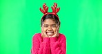 Face, Christmas horns and girl excited, green screen and happiness against a studio background. Portrait, young person and female child with smile, Xmas and surprise with excitement, joy and cheerful