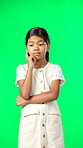 Green screen, idea and portrait of thinking child feeling excited, happy and isolated in a studio background. Smart, clever and young girl or kid pointing up at brand, product placement or mockup