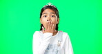 Children, portrait and wow with a girl on a green screen background background looking shocked. Portrait, surprise and omg with an adorable little female child hearing news or gossip on chromakey