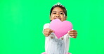 Portrait, heart and valentines day with a girl on a green screen background for the celebration of love. Kids, happy and romance with a cute little female child holding a cardboard shape on chromakey